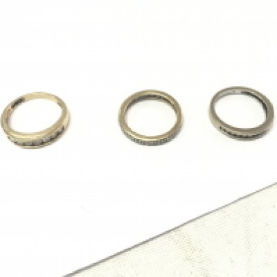 Three 9ct gold rings, two half eternity diamond rings and one full eternity ring. Approx weight 7.1 grams, size M1/2,N,O.