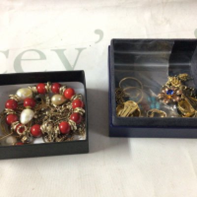 A small collection of silver and silver gilded jewellery, including a coral and pearl bracelet and earring set and other eastern style pendants.