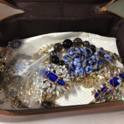 A small collection of costume jewellery in a vintage st micheals box.