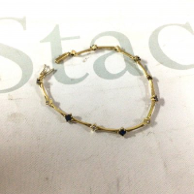 A 750 stamped diamond and sapphire bracelet. Approx weight 7.5 grams.