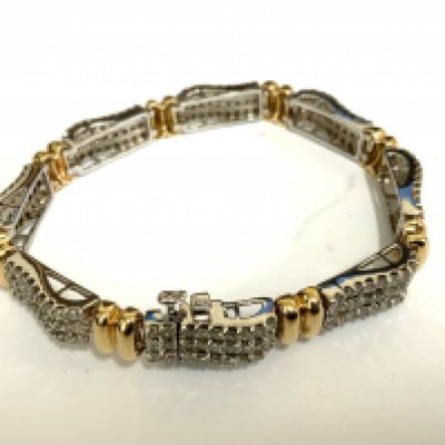 A good quality 14ct yellow and white gold bracelet made up of 8 sections each inset with 27, 0.01ct stones (total weight approximately 2.16ct). (A)