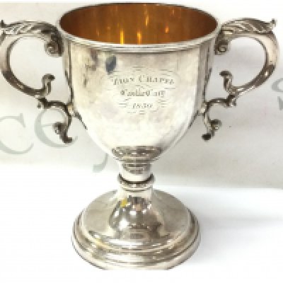 A heavy white metal communion cup dated 1850, approximately 575g. Postage category B