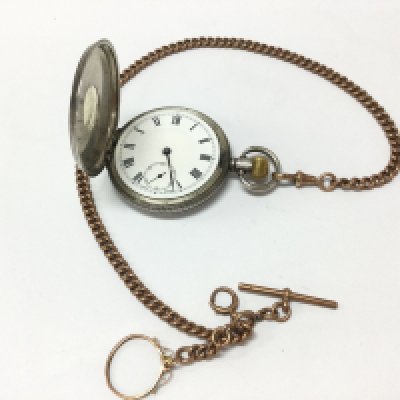 A hallmarked silver half hunter pocket watch and an Albert chain . Postage category A