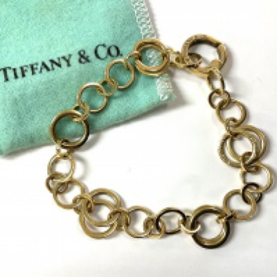A Genuine Tiffany & Co 18ct yellow gold double hoop bracelet, purchased late 70s.(18cm).