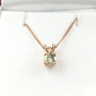 18ct rose gold solitaire pendant set with RBC Fancy yellow diamond on a rose gold plated silver chain. Diamond 0.71ct with cert. Postage A
