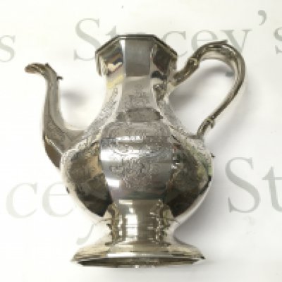 A hallmarked silver tea pot from circa 1842. 945g And approximately 26cm tall. In good condition.
