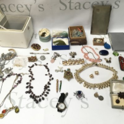 A collection of assorted costume jewellery including necklaces brooches silver watch Etc. Postage B