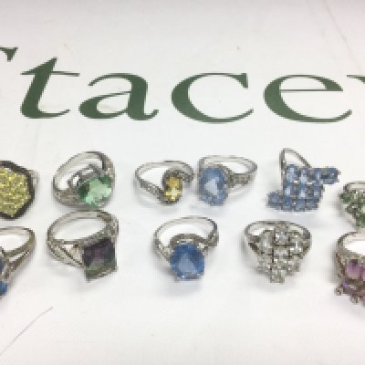 Eleven silver rings set with coloured stones. Shipping category A.