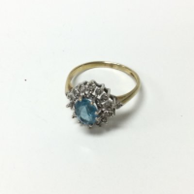 A 9ct gold aquamarine and diamond cluster ring. Approx weight 3.1 grams, size S.