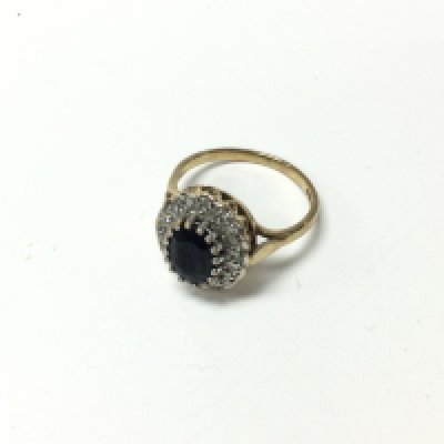 A 9ct gold sapphire and diamond cluster ring. Approx weight 3.34 grams, size M.