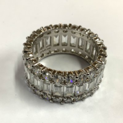 A steering silver and CZ eternity ring. Size S. (A) NO RESERVE