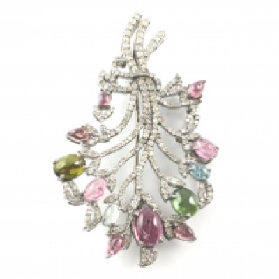 Tree of life style pin bar brooch set with multicoloured tourmalines and diamonds set in silver.Tourmalines 5.30ct and diamonds 2.40ct. Approximately 40mm by 70mm.Postage A