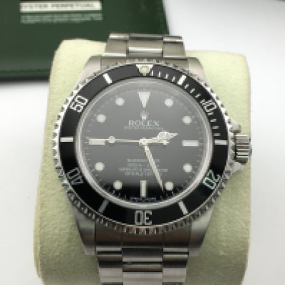 A Rolex Submariner no date ref 14060m circa 2010. 4 liner engraved rehaut. Steel case and oyster bracelet. Comes with box and warranty card and watch master paperwork. Seen running.