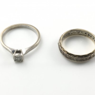 9ct white gold ring set with 0.10ct diamond Size N and a 9ct white and yellow gold eternity ring size L 4g total