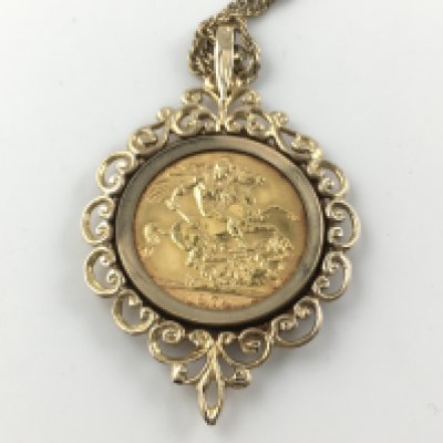 A 1974 full sovereign with 9ct mount and chain 17.56g Postage A