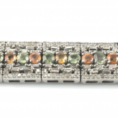 Deco style line bracelet set with multicoloured sapphires and round and baguette cut diamonds With open box clasp and double safety catch in silver. Sapphires 8.83ct and diamonds 5.43ct. 19cm long.Postage A