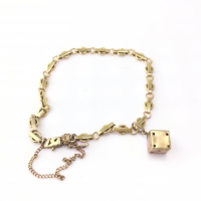 A 9ct gold bracelet with a charm attached. 12.01g