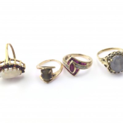 Four 9ct gold rings set was assorted stones including opal. 17.07g Postage B
