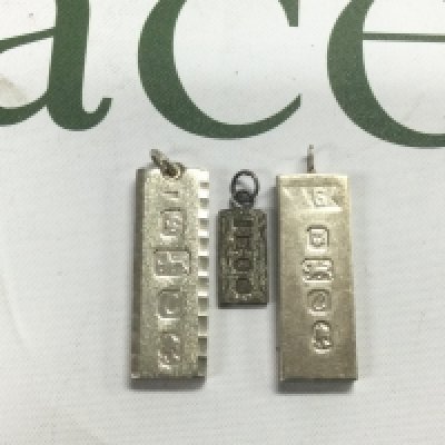 Three silver ingots. Shipping category A.