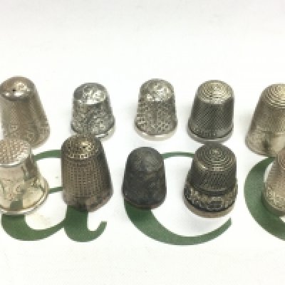 Ten silver thimbles. Shipping category A.