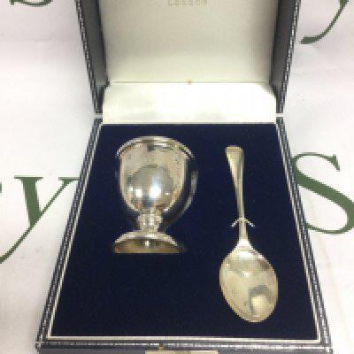 A boxed Mappin & Webb silver egg cup and spoon, Birmingham hallmarks. Shipping category B.