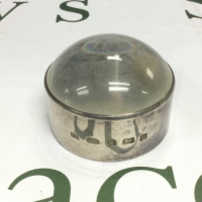 An oversized silver magnifying glass, Sheffield hallmarks. Shipping category D.
