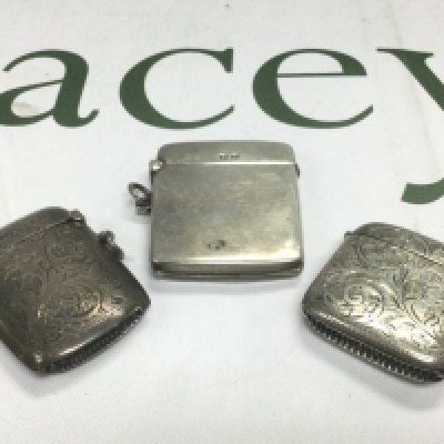 Three silver vesta cases. Shipping category A.