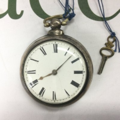 A Victorian silver hallmarked verge pocket watch with key. Approx diameter 6cm. Shipping category A.