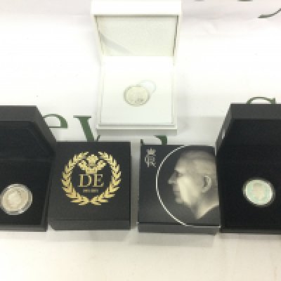 Three boxed silver coins to include a silver sovereign. Shipping category A.