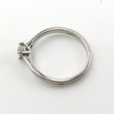 A platinum and diamond ring. Size K 1/2 and 2.65g. Diamond is approximately colour G and SI1 Postage A
