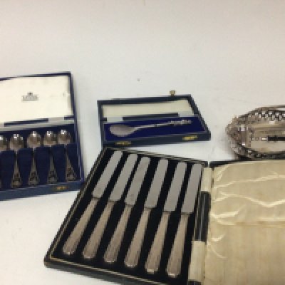 A cased set of ornate silver spoons a cased apostle spoon St Peter and other cutlery and oddments.