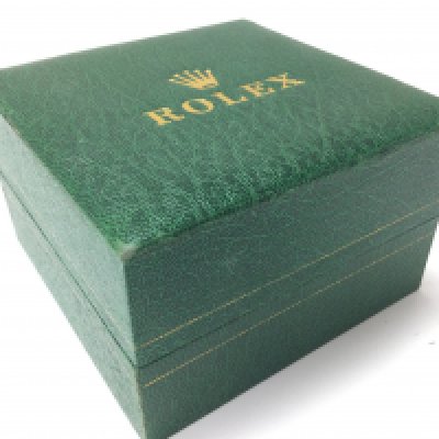 A vintage Rolex watch box. Postage category a