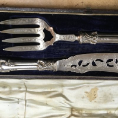 A cased pair of Victorian silver fish servers.
