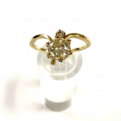 A yellow gold ring inset with a 1.25ct round brilliant cut solitaire diamond, estimated colour K/L, clarity Si, surmounted with a small 0.8ct , (A) complete with Independent jewellery report. (A)