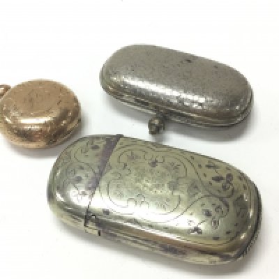 A Gold plated sovereign case, Vesta vase and another sovereign case. Postage category A