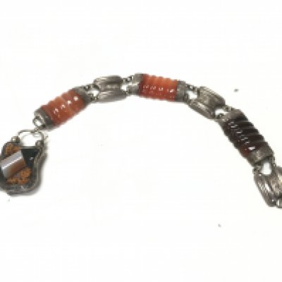 A silver and enamel bracelet. Postage B