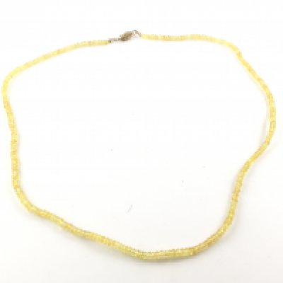 A yellow sapphire necklace with a 9ct gold clasp. Postage A