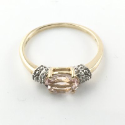 A 9ct yellow gold oval cut morganite ring with diamond shoulders. Size P 1/2 and 2.06g Postage A