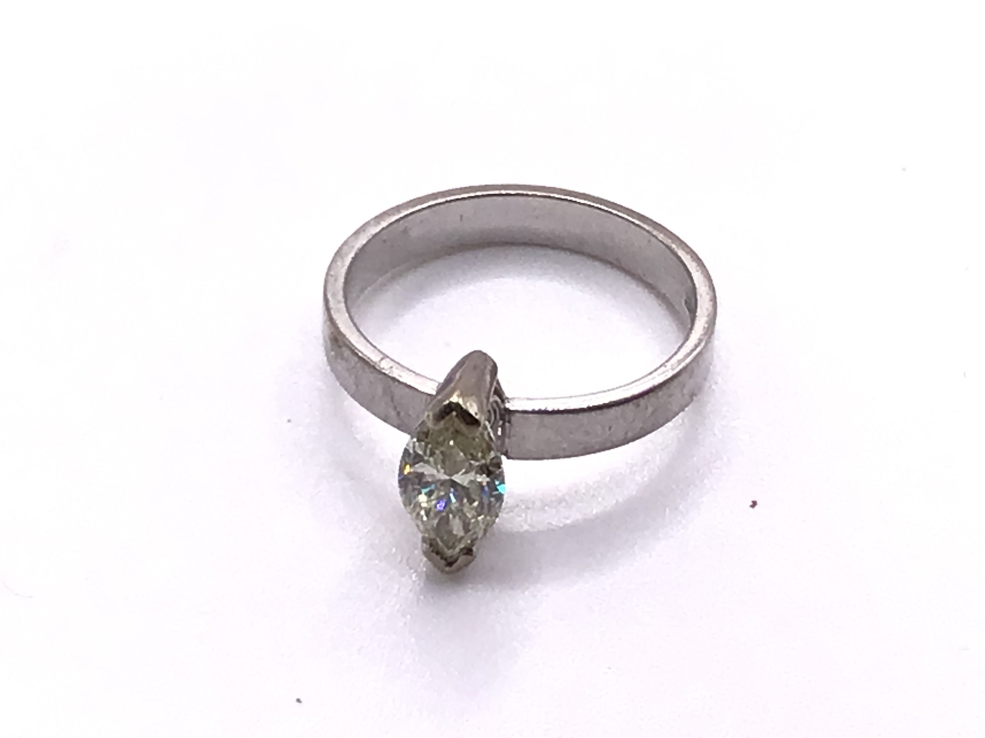 An 18ct white gold marquise set diamond ring. Size H, Approx 2.5g, (A).