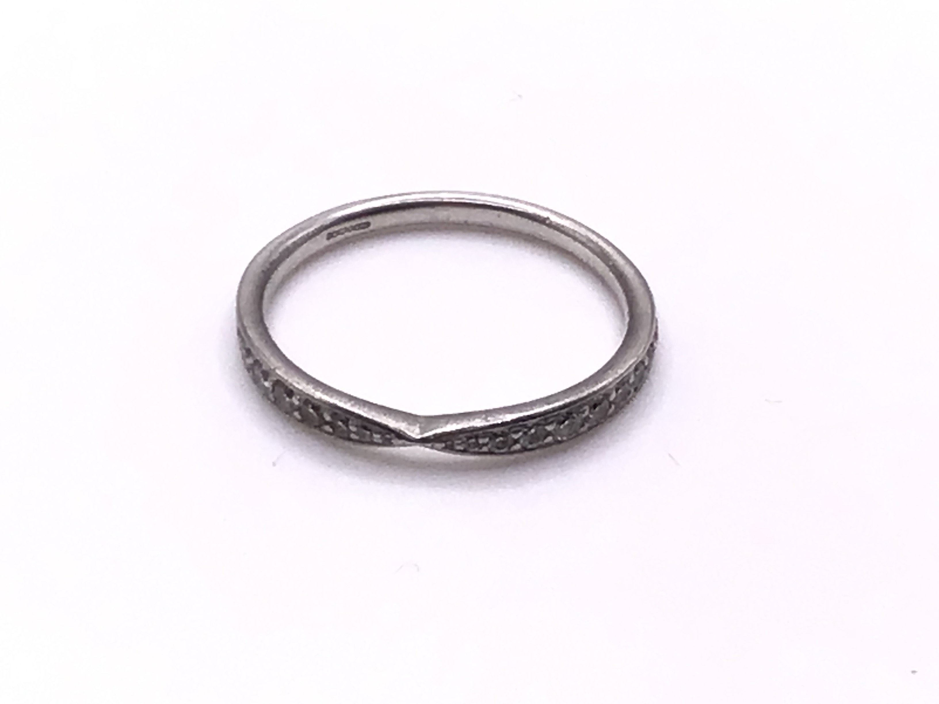 A platinum and diamond twist design ring, Size O, (A