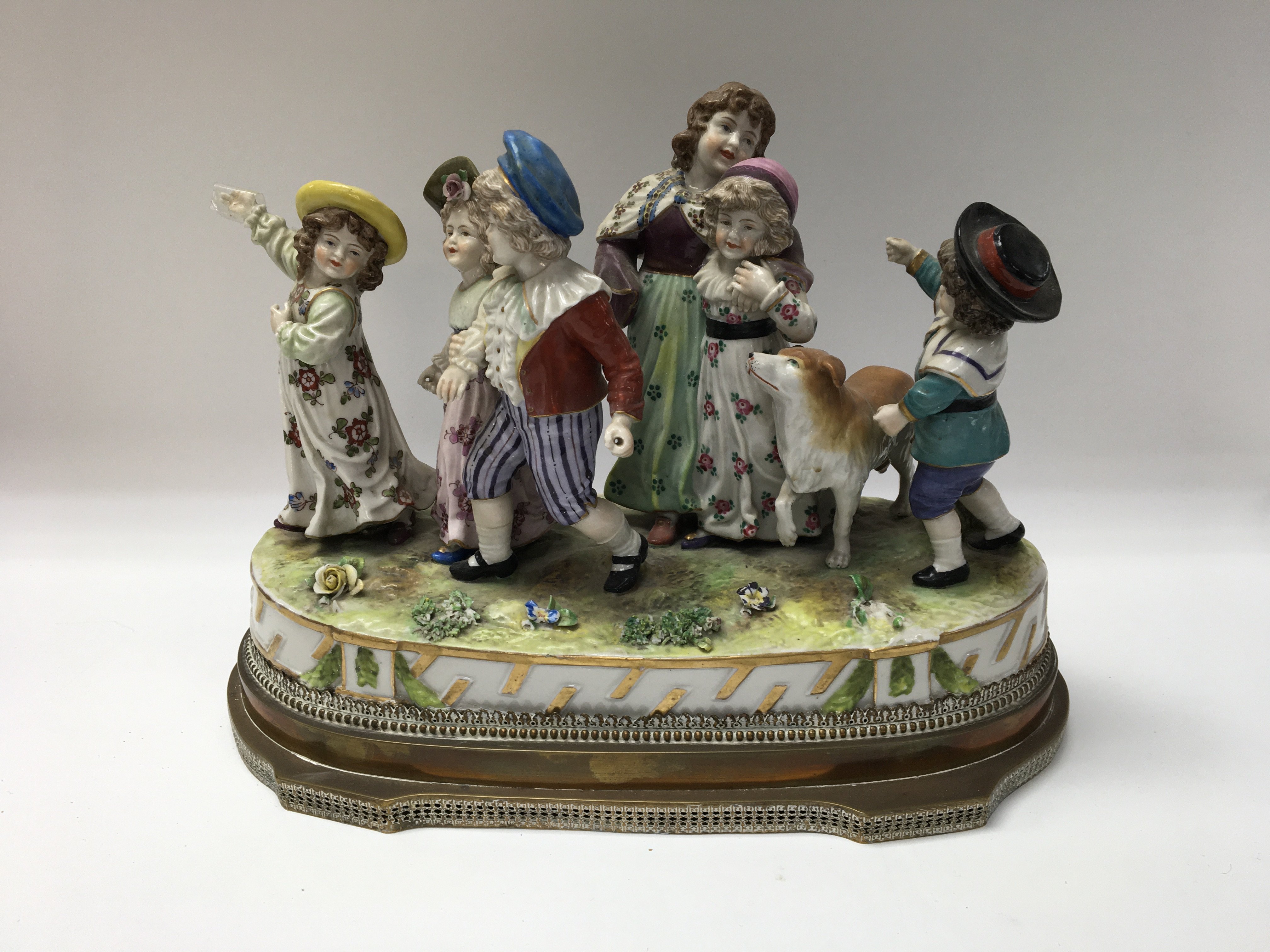 European porcelain figure with some damage to the piece. Shipping category B.