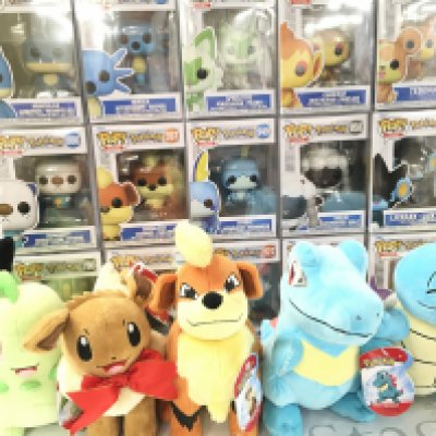A Collection of Boxed Funko Pop Figures all Pokemon And Pokemon Soft Toys.