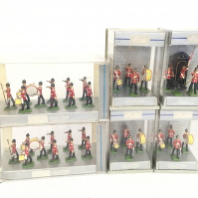 A group of 6 plastic display cases in the Britains Collection mainly featuring marching bands. No reserve