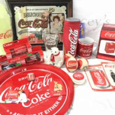 A Collection of Coca-Cola Merchandise. Includes a Coke Mirror. No Reserve.