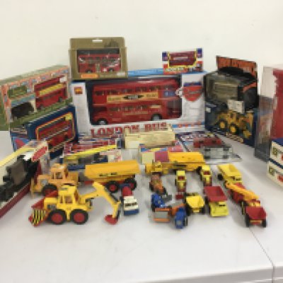 A collection of boxed and loose Playworn diecast and plastic model vehicles predominantly buses and construction. Large remote control bus. Manufacturers include Matchbox..Lledo etc. no reserve