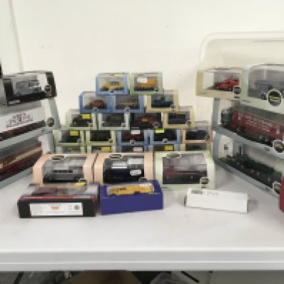 A collection of Oxford diecast model vehicles in display boxes featuring fire engines..buses..cars etc. no reserve