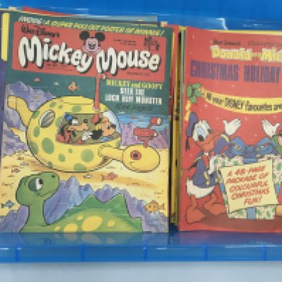 A collection of approximately 200 Disney comics featuring Donald and Mickey including some specials and a selection of free gifts given with some of the comics. No reserve