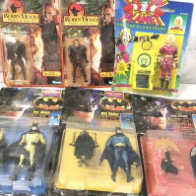 6 Assorted Carded Figures. Batman And Robin Hood. with Some Damp Damage.