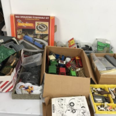 A mixed collection of Hornby 00gauge model railway accessories including track ..buildings..scenery etc. plus a collection of Britains tractors..farm machinery and animals.