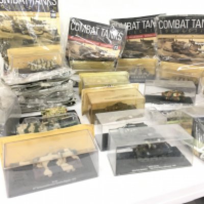 A collection in excess of 15 Combat Tanks magazines and models. No reserve